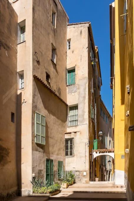 Between The Roofs Of Menton Old Town And The Sea Bagian luar foto