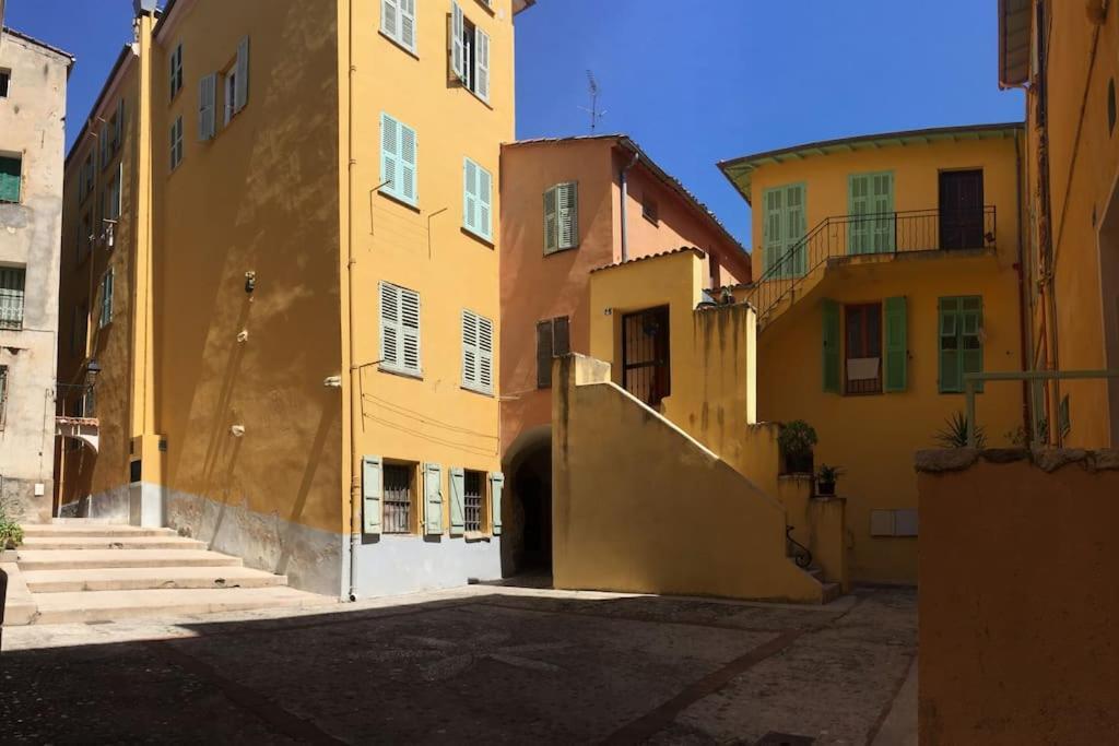 Between The Roofs Of Menton Old Town And The Sea Bagian luar foto